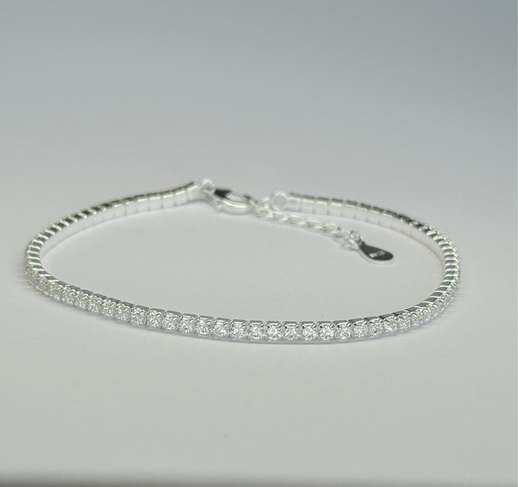 925 sterling silver tennis bracelet with cubic zirconia inlay, adjustable size, elegant design for any occasion.